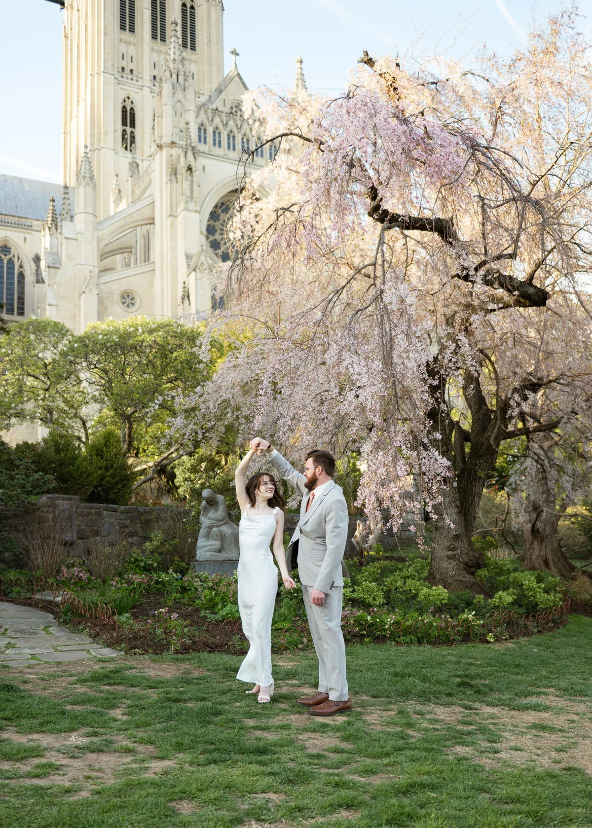 Jeremy and Winter dancing beneath flowering trees